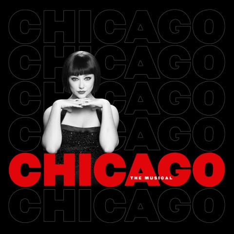 A lady holding her hands a folded arms resting on the CHICAGO logo