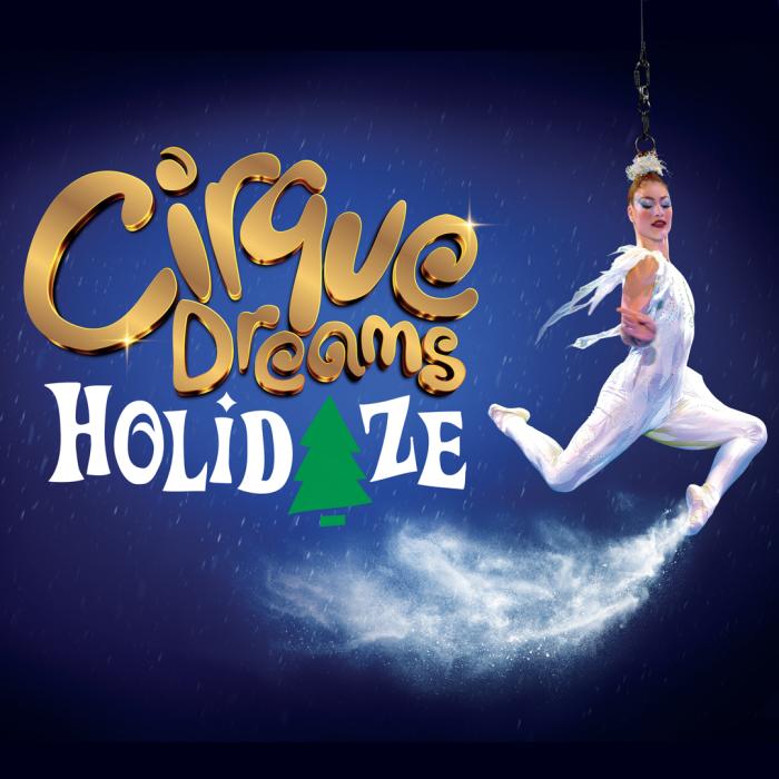 Cirque Dream Holidaze female acrobat flying throught the air dressed in white