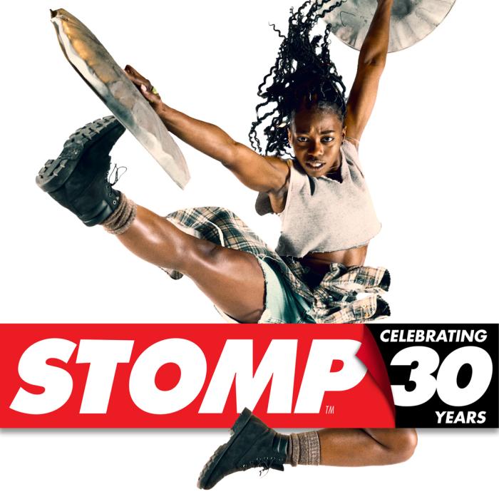 Girl jumping in the air over the STOMP logo