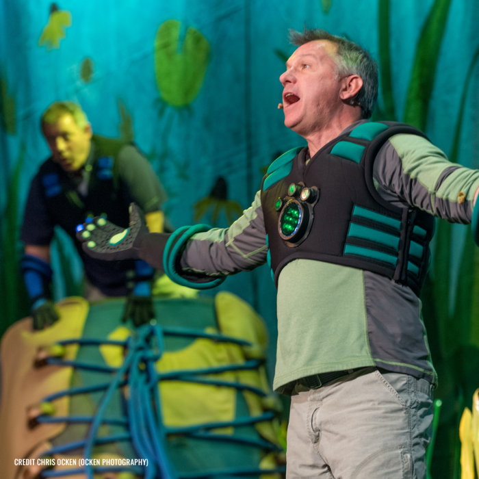 Kratts with arms wide open